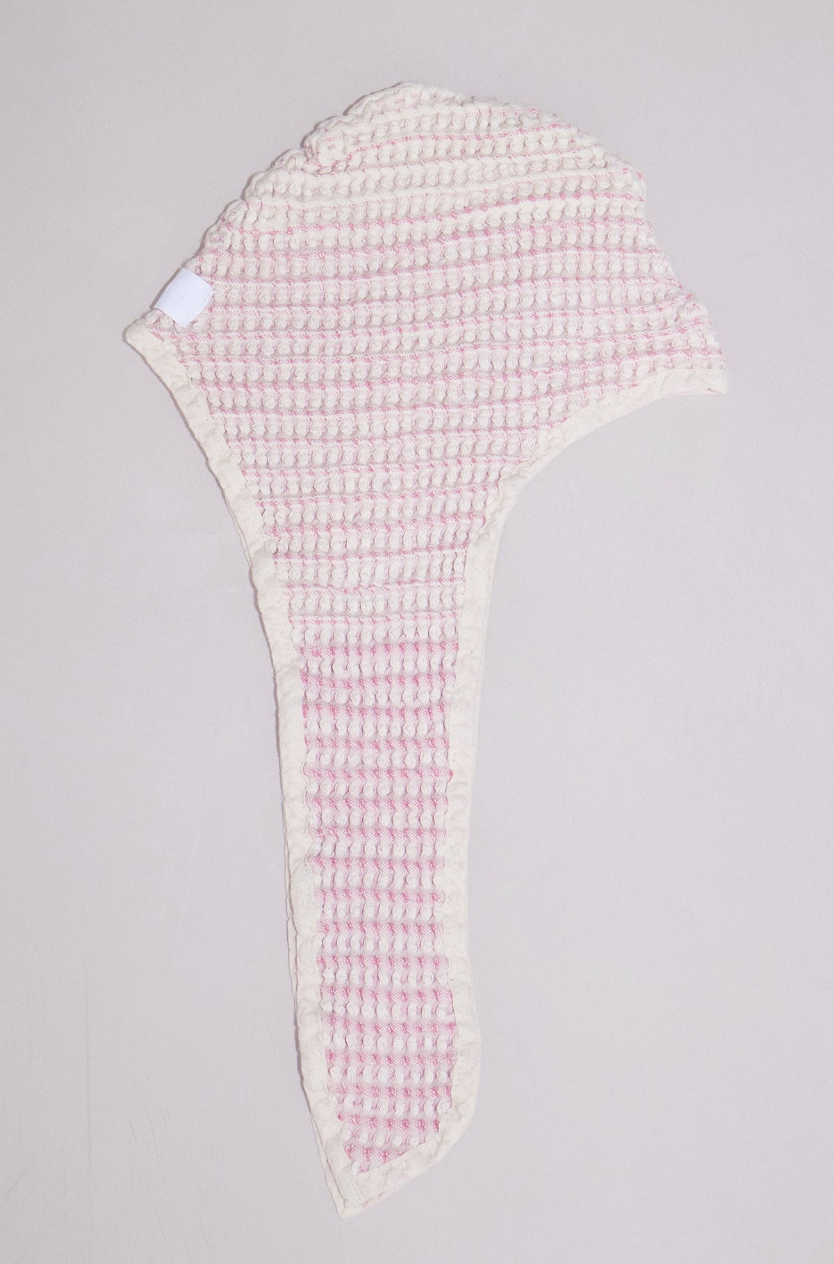 Close-up of Shell baby bath bonnet showing soft natural cotton texture