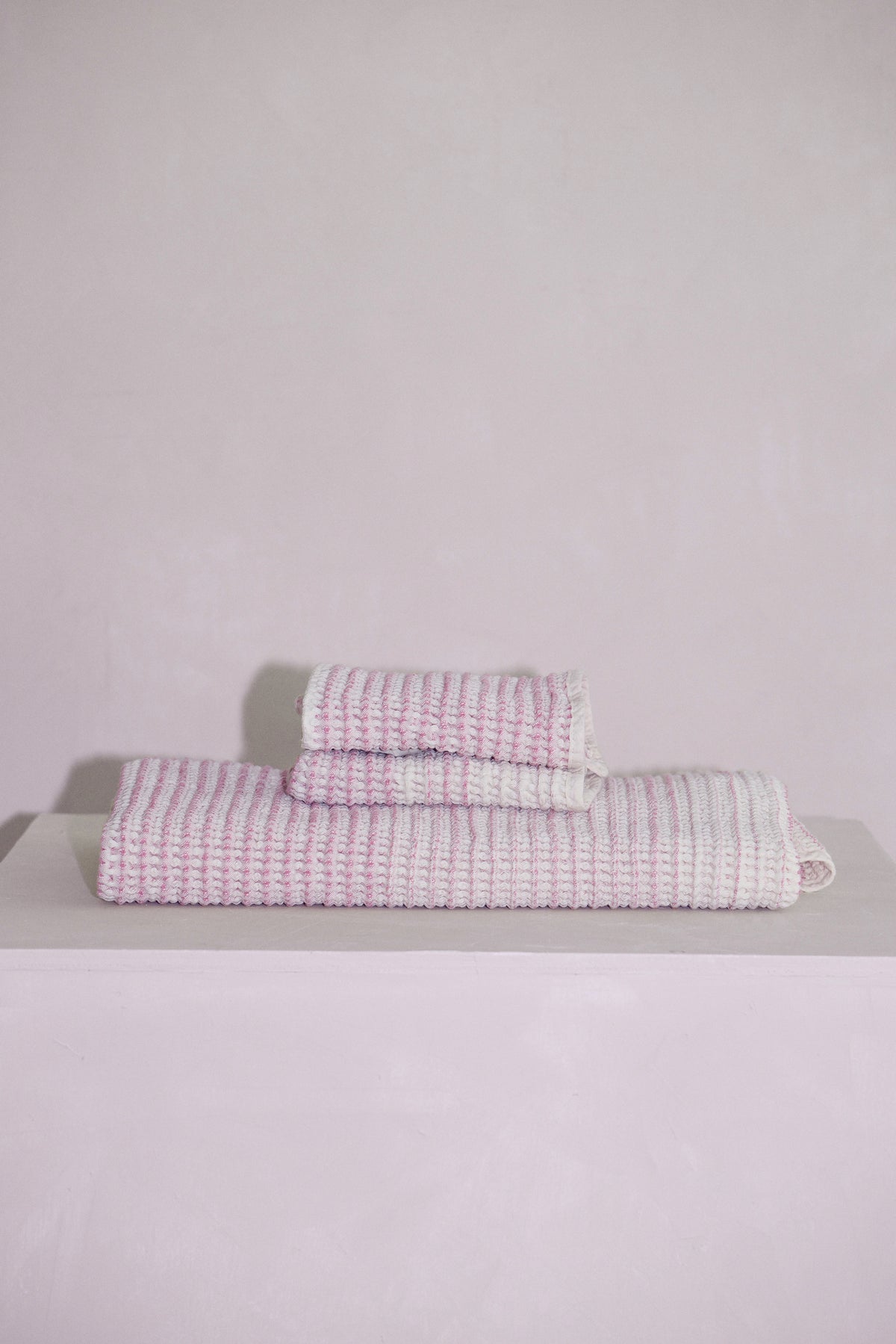 Stacked Shell baby towels highlighting absorbent natural fibers