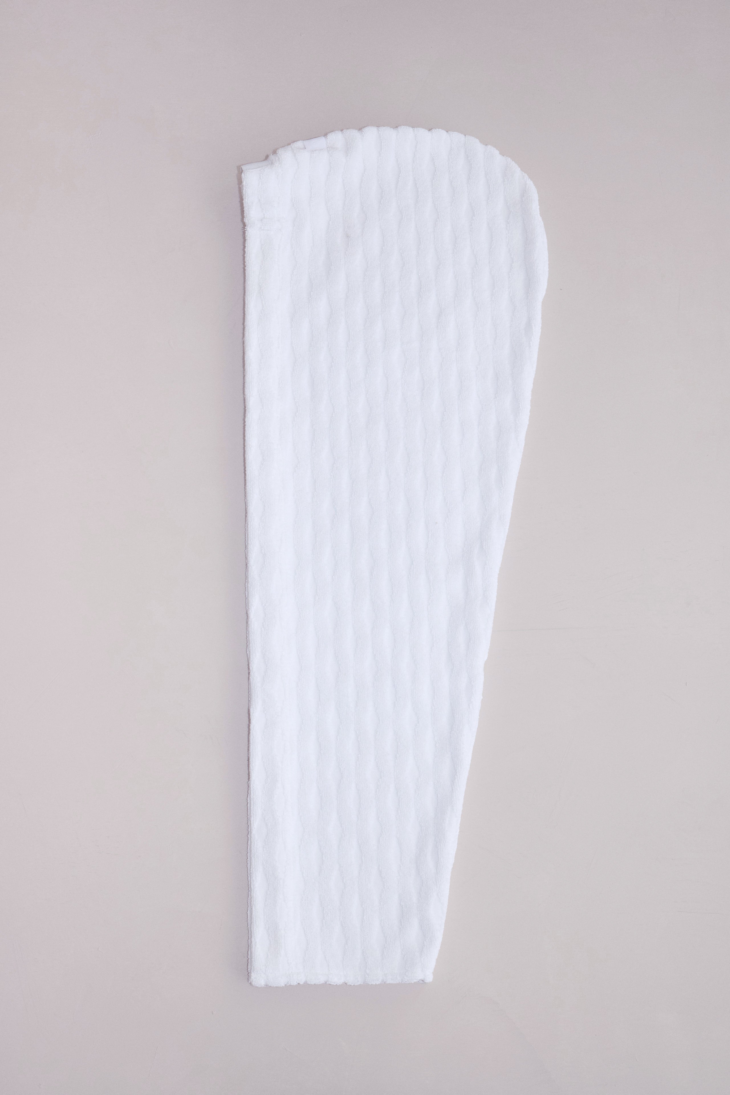 Cotton-linen terrycloth hair wrap folded neatly on a neutral surface