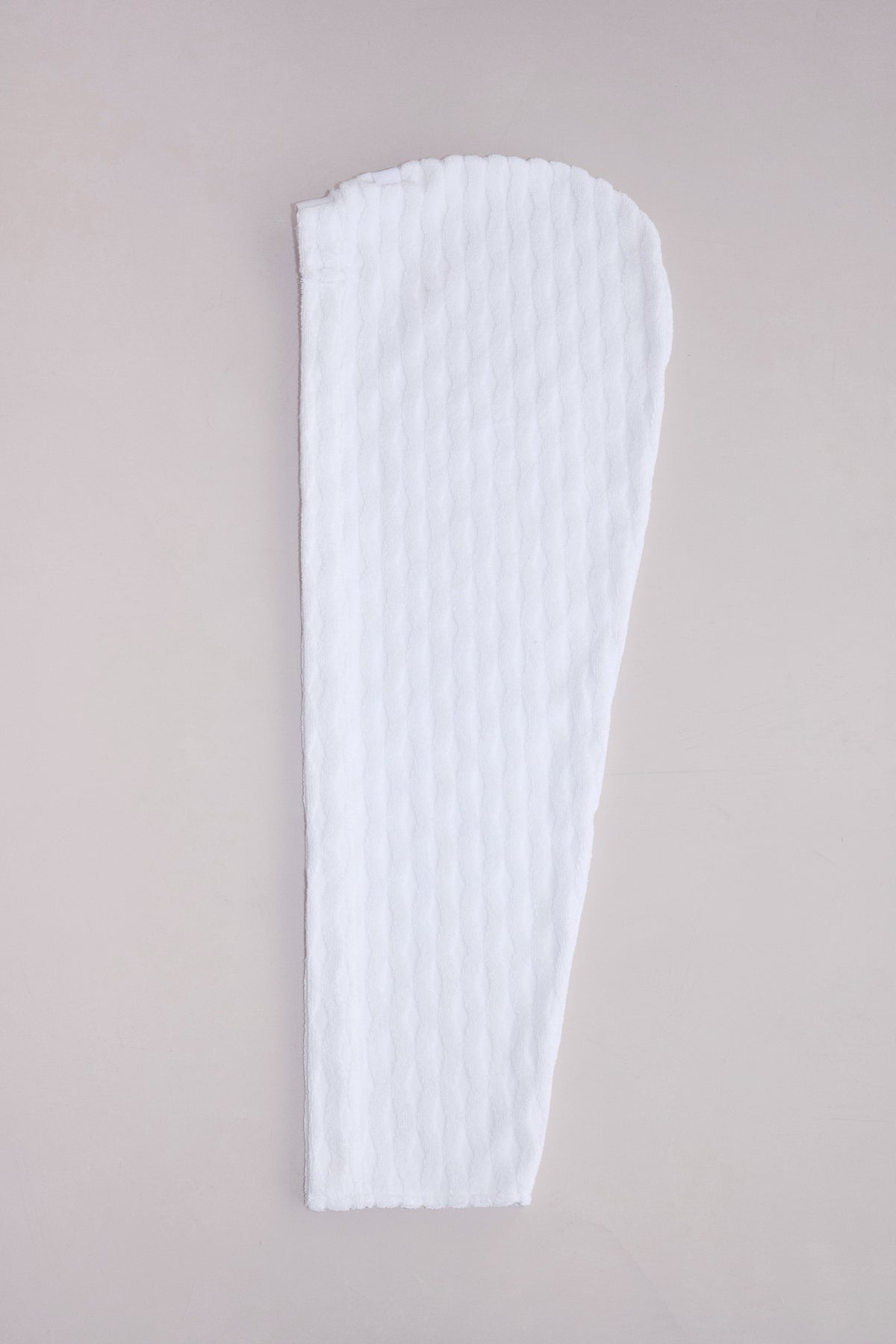 Cotton-linen terrycloth hair wrap folded neatly on a neutral surface