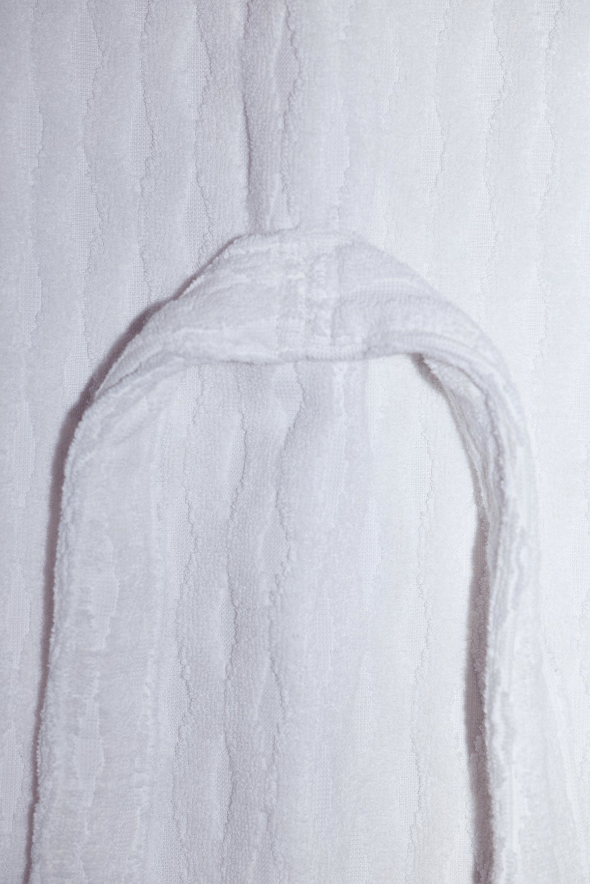 Close up of the back robe tie and a detailed image of the woven terrycloth texture