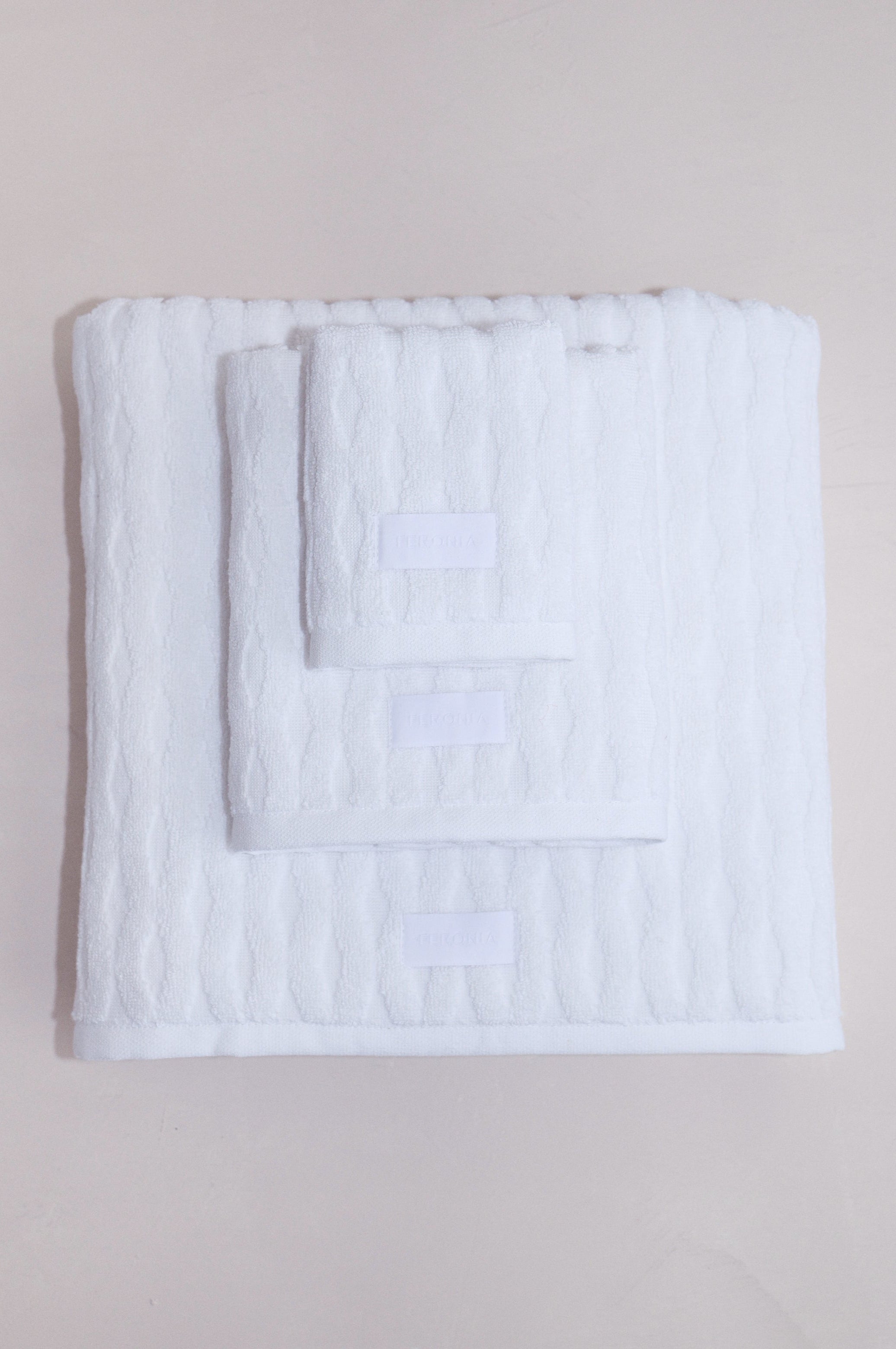 Cotton-linen Ellipse towel set folded flat, showing soft terrycloth texture and color