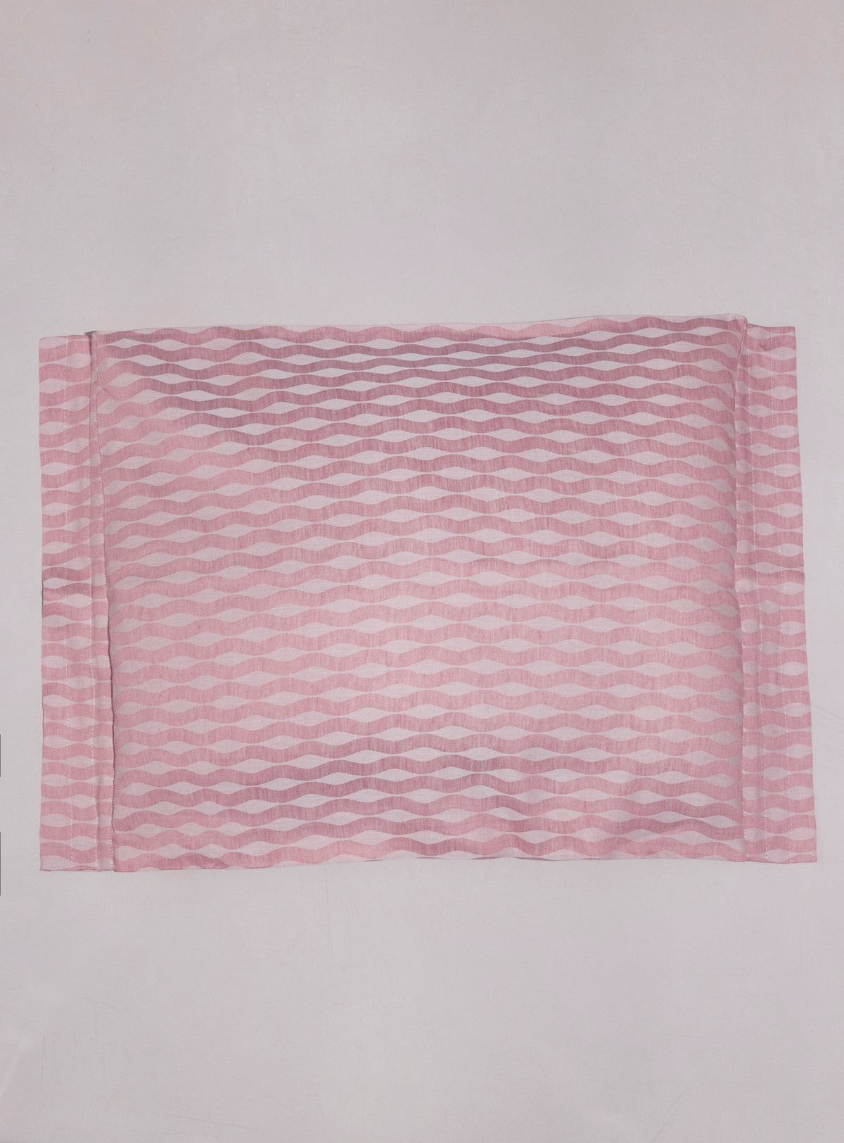 Single pink slat sham photographed from above
