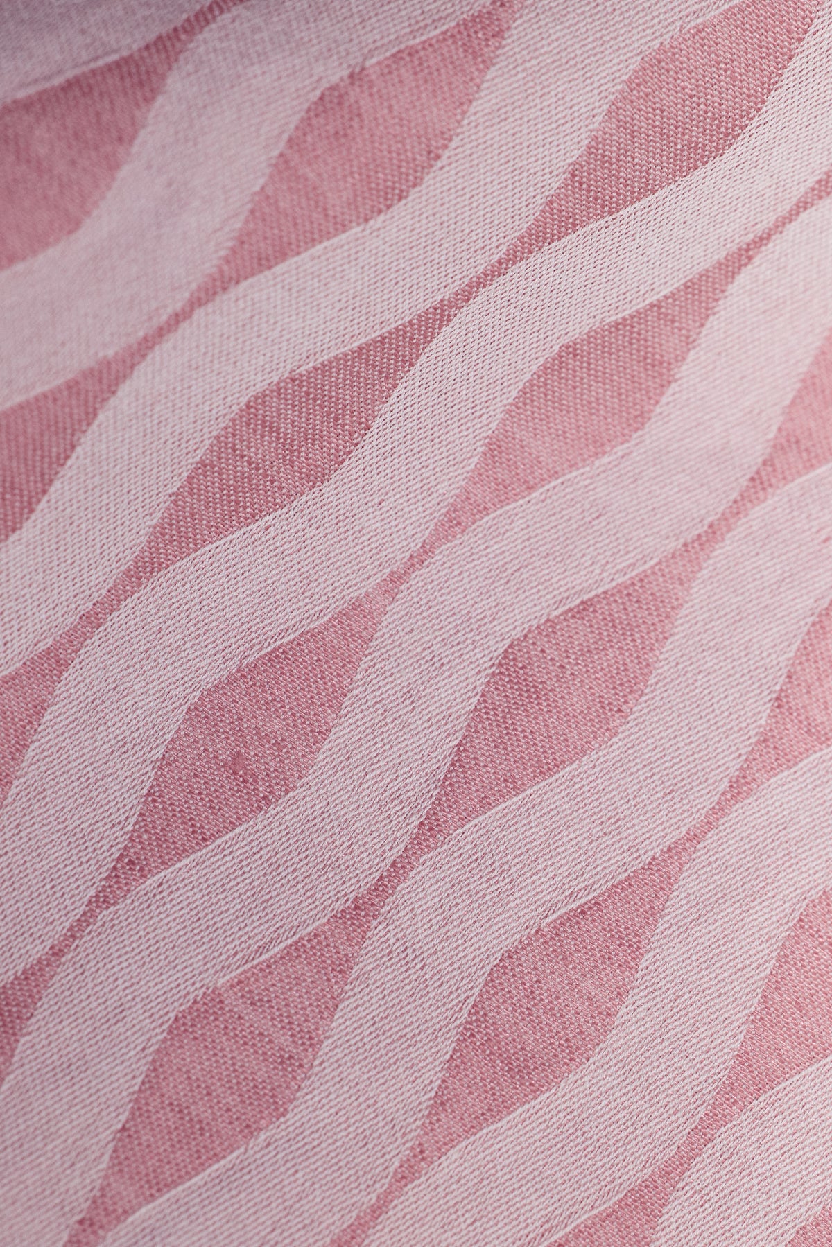 Close up of jacquard woven ellipse pattern in pink salt