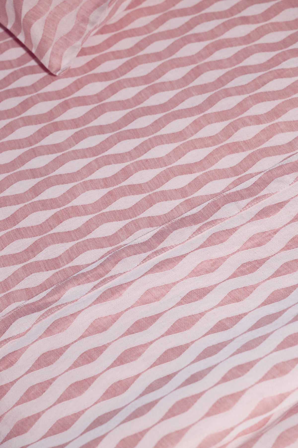 detailed shot of jacquard wave pattern woven in the linen cotton fabric with a light luster