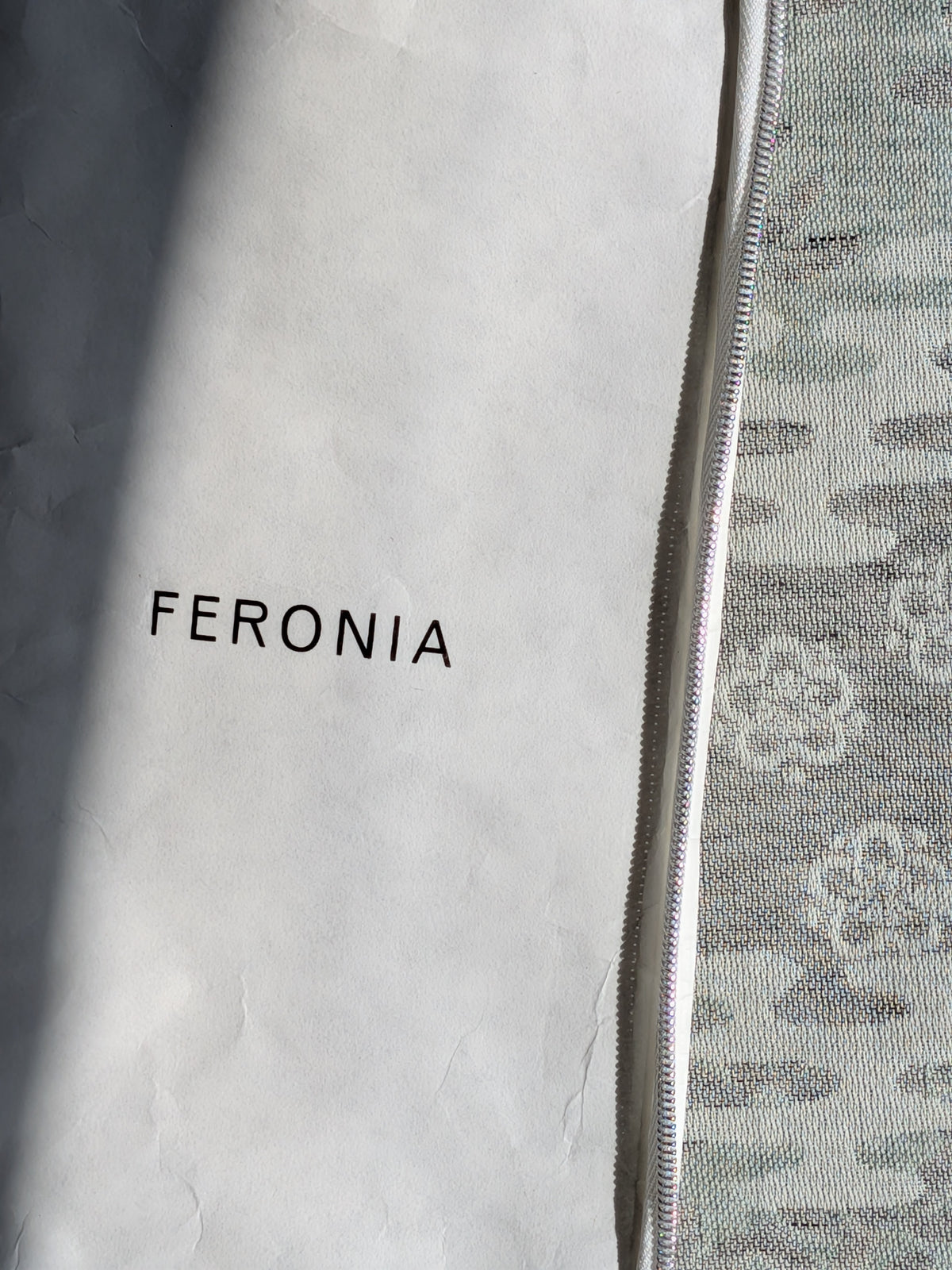 Feronia gift pouch with the Sake/Shiso plum blossom jacquard kitchen towel tucked alongside